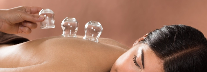 A person with cupping cups on their back.