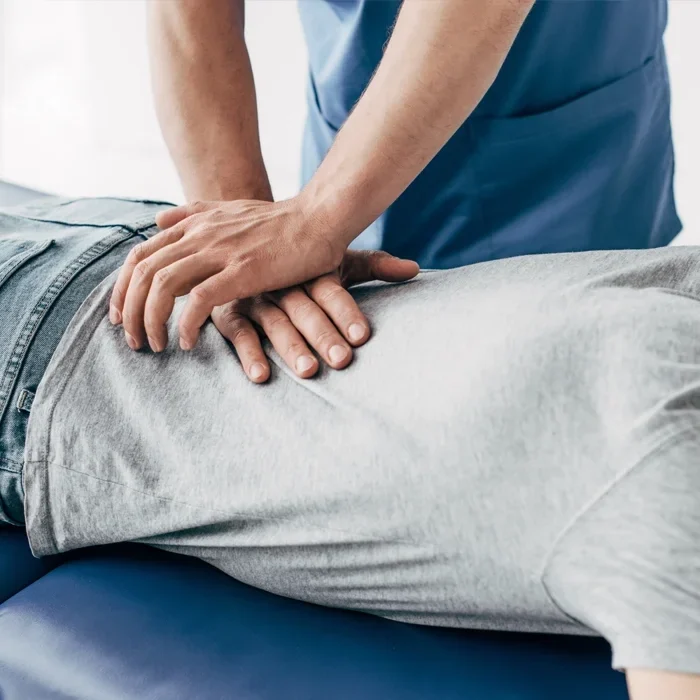 A person receiving a back adjustment.